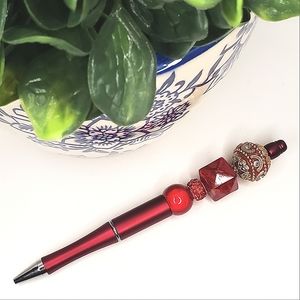 LADY IN RED BEADED PEN